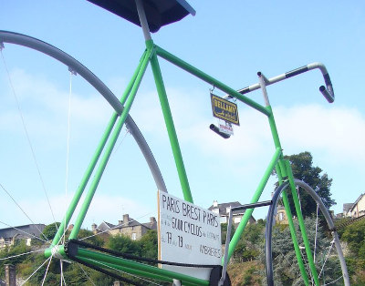 Oversized green bike celebrating Paris Brest Paris.