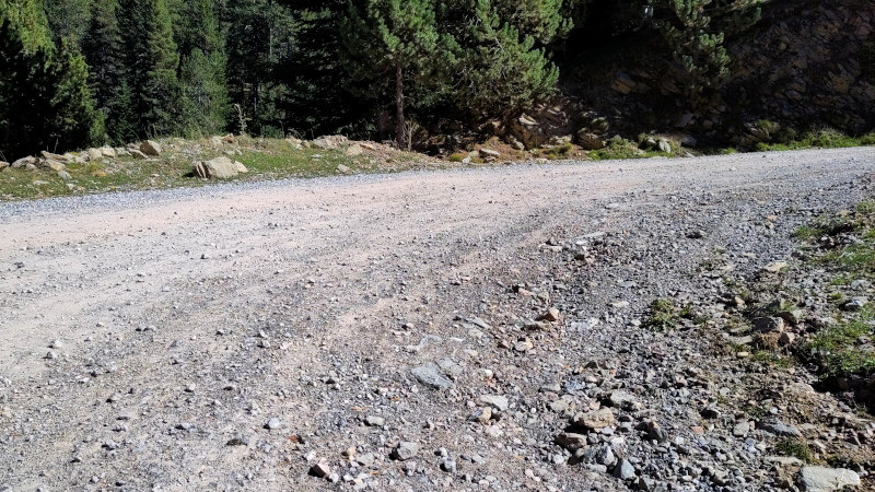 Close up of rough gravel road with rocks from pea-size to fist-size