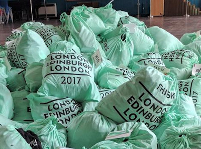 Pile of green bags marked London Edinburgh London 2017, Thirsk